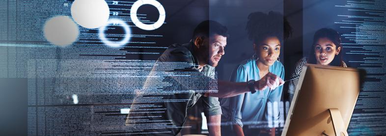 Three people looking at monitor