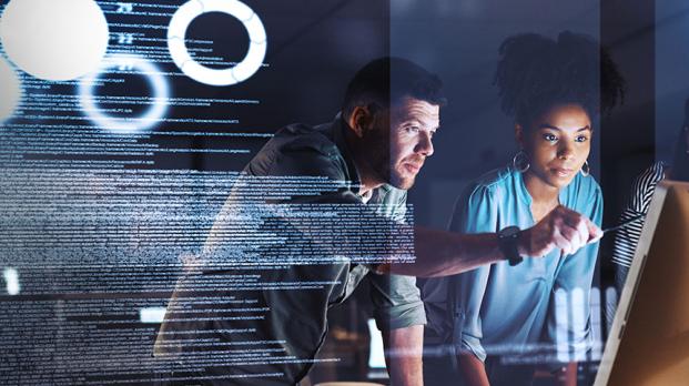 Three people looking at monitor