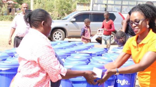 EFL staff passing out water