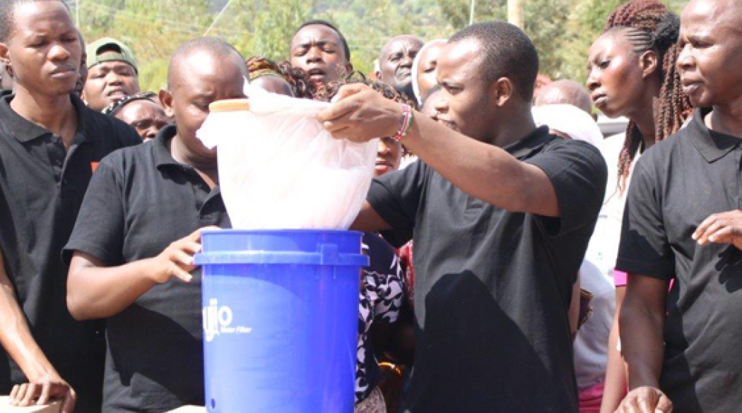 EFT staff with blue bucket