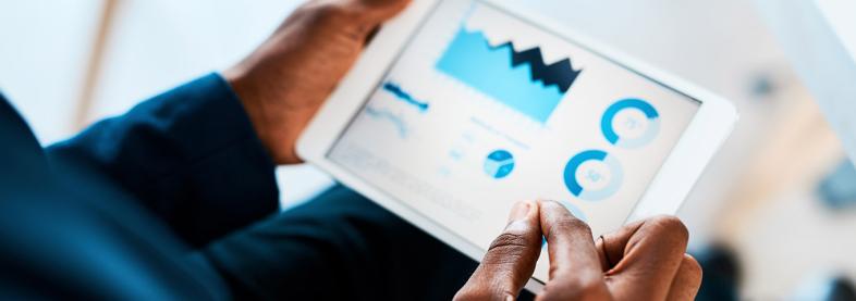 Man looking at a digital dashboard on an iPad