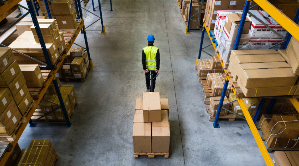 Warehouse worker with a palette of boxes