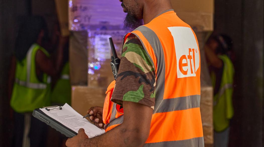 Warehouse worker with a palette of boxes